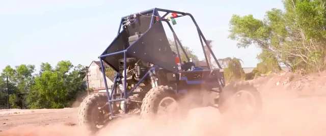 Baja buggy kicking up dust on the track
