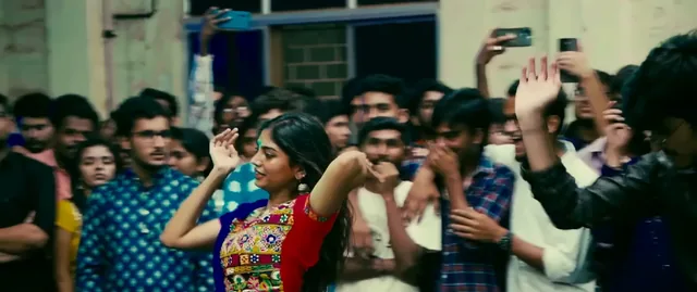 Students dancing in the crowd