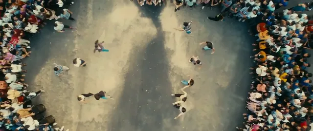 Overhead view of dancers surrounded by the crowd