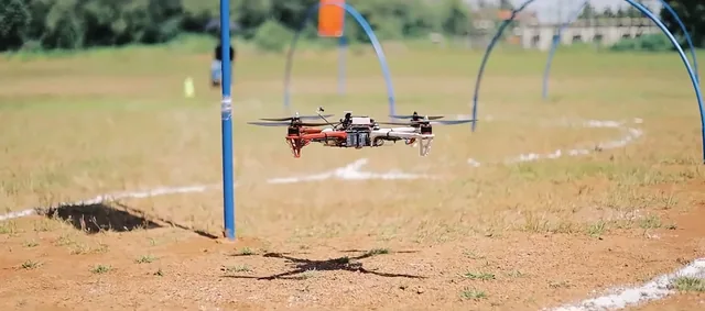 Racing drone flying through the course